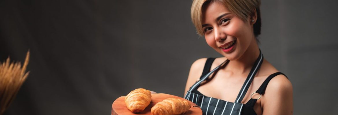 baker-presenting-freshly-baked-croissants-in-cafe-that-made-of-puff-pastry-looking-yummy